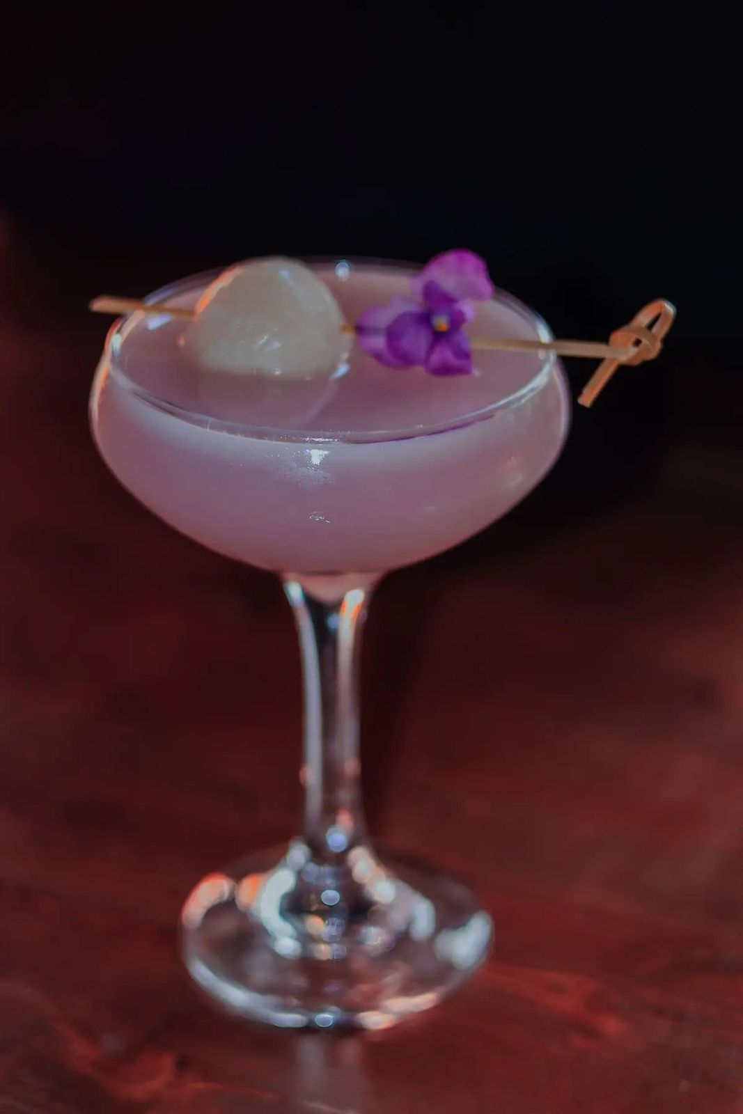 Pink coupe with lychee and orchid